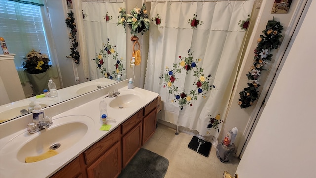 bathroom featuring vanity, tile patterned flooring, and curtained shower