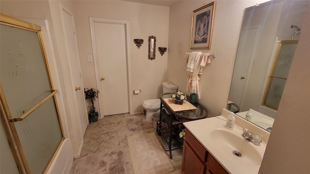 full bathroom featuring shower / bath combination with glass door, vanity, and toilet