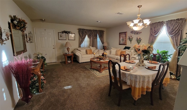 carpeted dining space with an inviting chandelier and a wealth of natural light