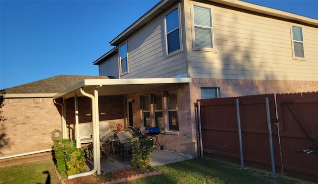 back of property featuring a patio