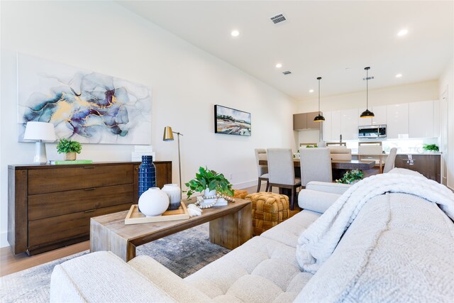 living room with light hardwood / wood-style floors