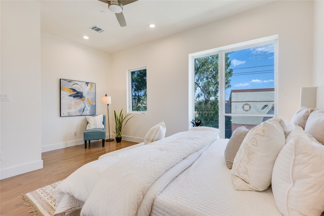 bedroom with hardwood / wood-style flooring and ceiling fan