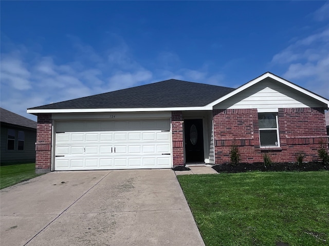 single story home featuring a front yard and a garage