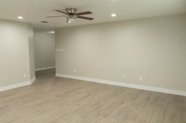 spare room with ceiling fan and light hardwood / wood-style flooring