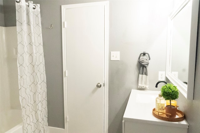 bathroom with shower / bath combination with curtain and vanity