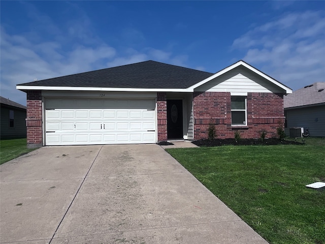 single story home with a garage, central air condition unit, and a front yard