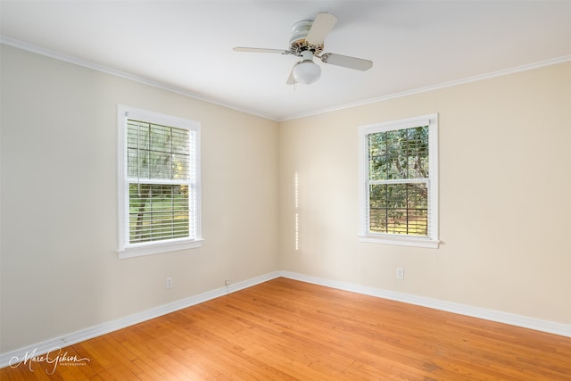 empty room with ceiling fan, light hardwood / wood-style flooring, and ornamental molding