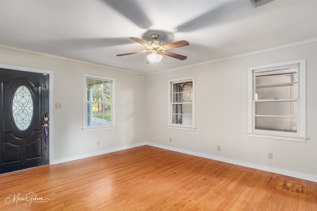 entrance foyer with light hardwood / wood-style floors, ornamental molding, and ceiling fan