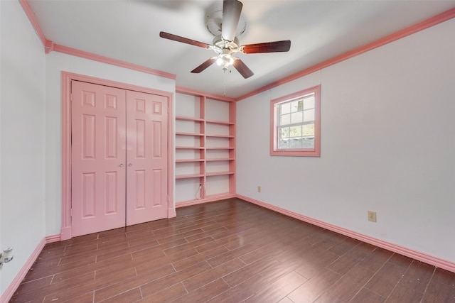 unfurnished bedroom with ceiling fan, ornamental molding, and hardwood / wood-style flooring