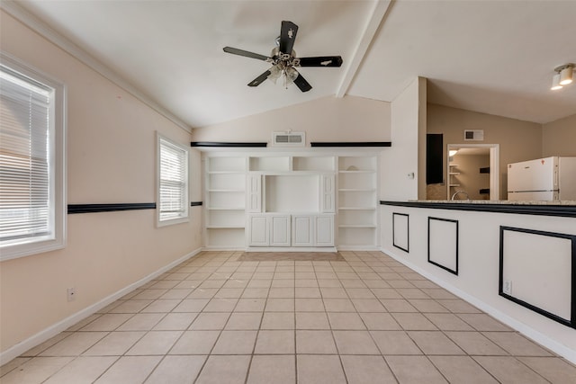 interior space with ceiling fan, light tile patterned floors, and lofted ceiling with beams