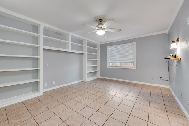 tiled spare room with ceiling fan, crown molding, and built in features