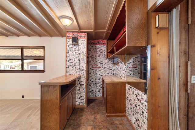 wine room featuring dark tile patterned floors