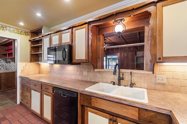 kitchen with ornamental molding, sink, tasteful backsplash, and black appliances