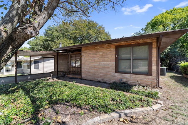 single story home featuring central AC unit