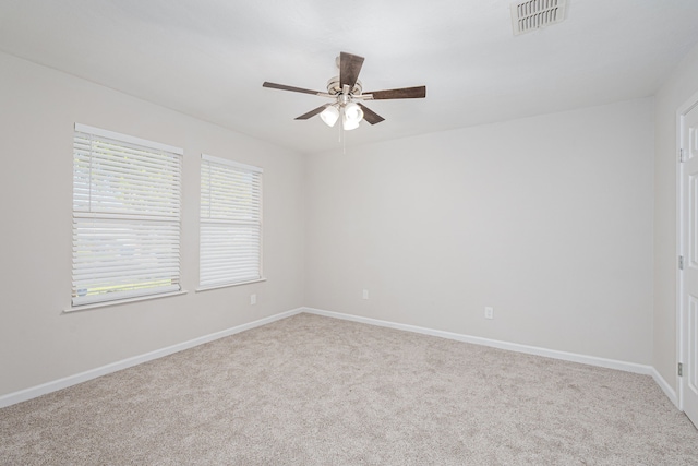 carpeted empty room with ceiling fan