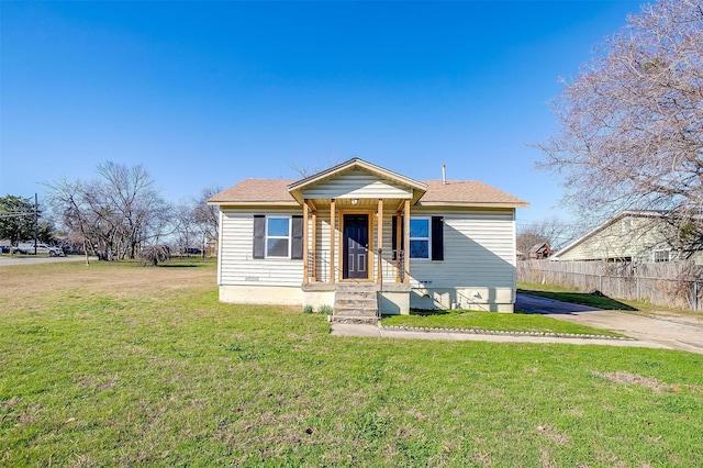 bungalow-style home featuring a front lawn