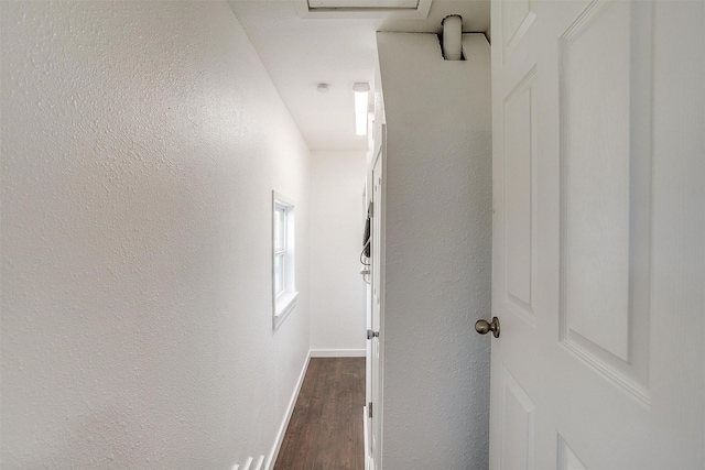 hall featuring dark wood-type flooring