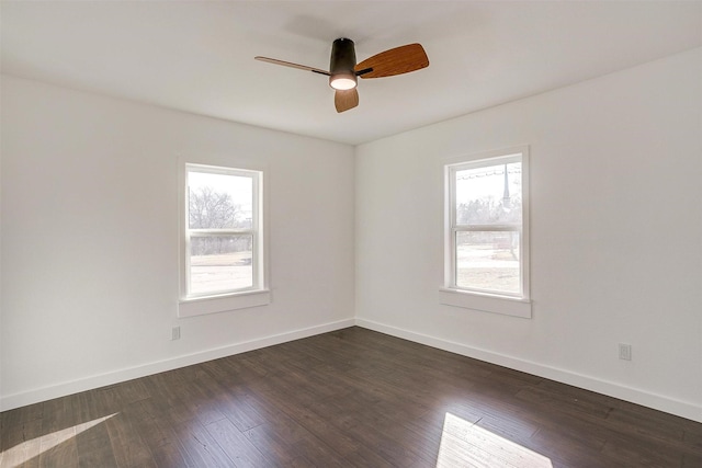 spare room featuring ceiling fan and dark hardwood / wood-style flooring