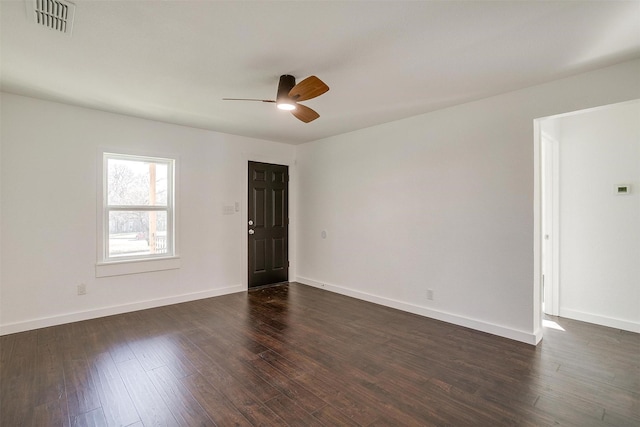 empty room featuring dark hardwood / wood-style floors and ceiling fan