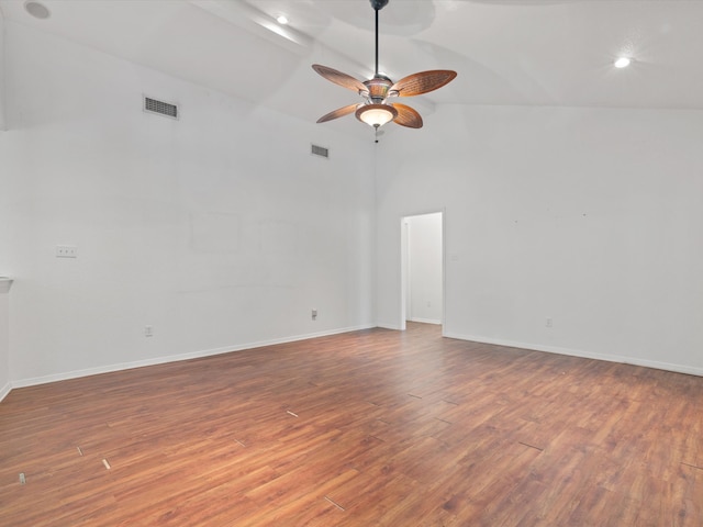 unfurnished room with hardwood / wood-style flooring, ceiling fan, and high vaulted ceiling