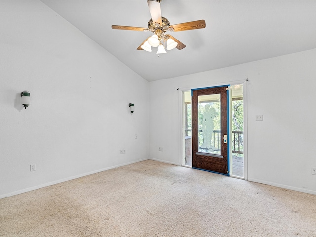 unfurnished room featuring light colored carpet, vaulted ceiling, and ceiling fan