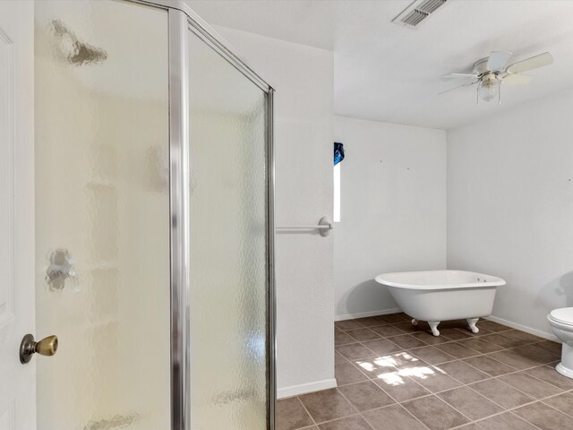 bathroom featuring toilet, tile patterned floors, ceiling fan, and independent shower and bath