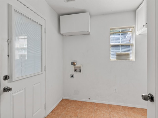 laundry area featuring electric dryer hookup, cabinets, and washer hookup