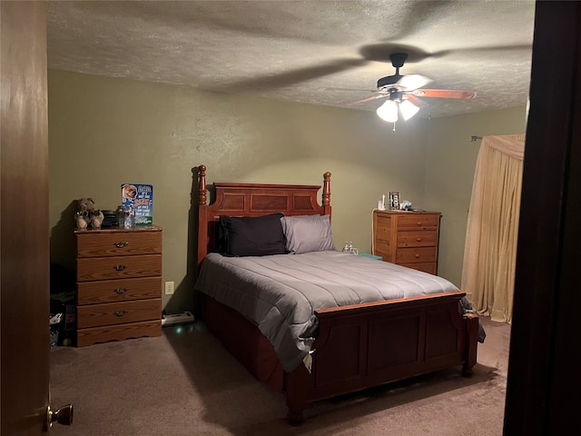 bedroom featuring light carpet, a textured ceiling, and ceiling fan