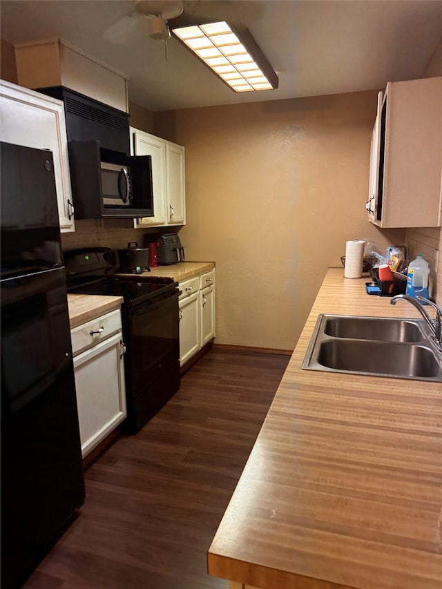 kitchen with white cabinets, ceiling fan, dark hardwood / wood-style flooring, black appliances, and sink