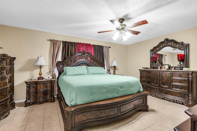 tiled bedroom with ceiling fan and a textured ceiling