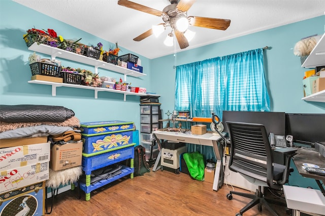 office area with ceiling fan and hardwood / wood-style flooring