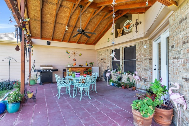 view of patio with ceiling fan and grilling area