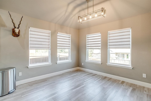 empty room with light hardwood / wood-style floors