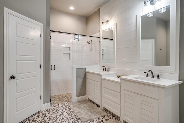 bathroom with vanity, tile patterned floors, and a shower with shower door