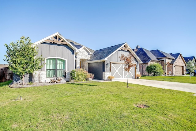 view of front facade with a garage and a front lawn