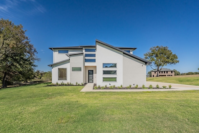 contemporary home featuring a front yard