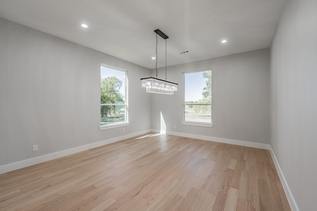 unfurnished room with plenty of natural light and light wood-type flooring