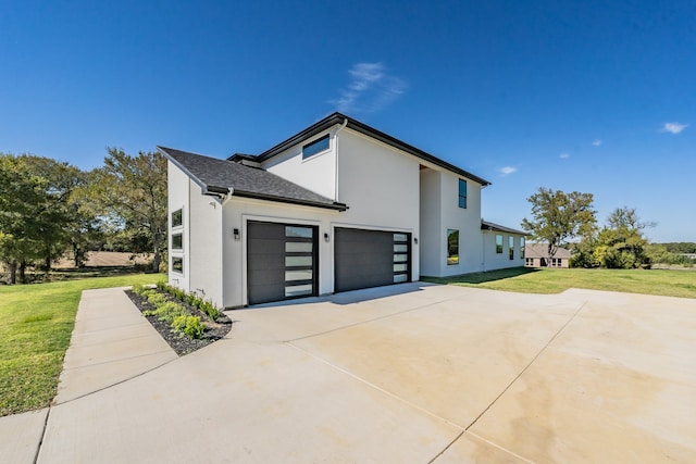 view of home's exterior featuring a yard and a garage