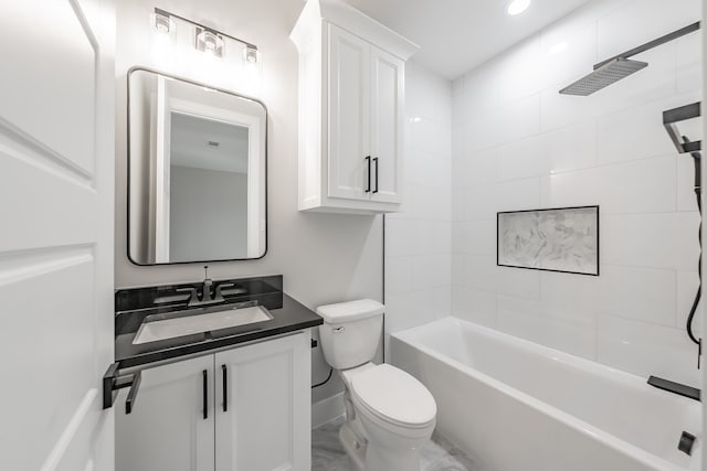 full bathroom with toilet, tiled shower / bath combo, and vanity