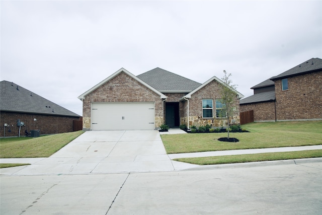 view of front facade with a garage and a front yard