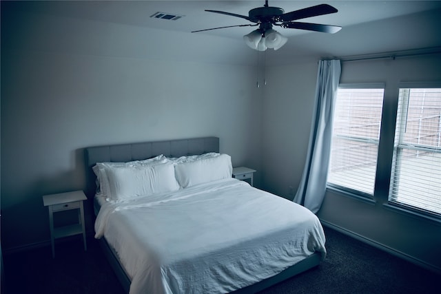 carpeted bedroom featuring ceiling fan