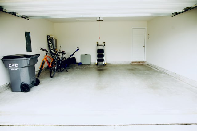 garage with electric panel and a garage door opener