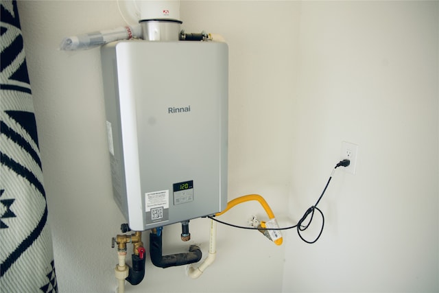 utility room with water heater