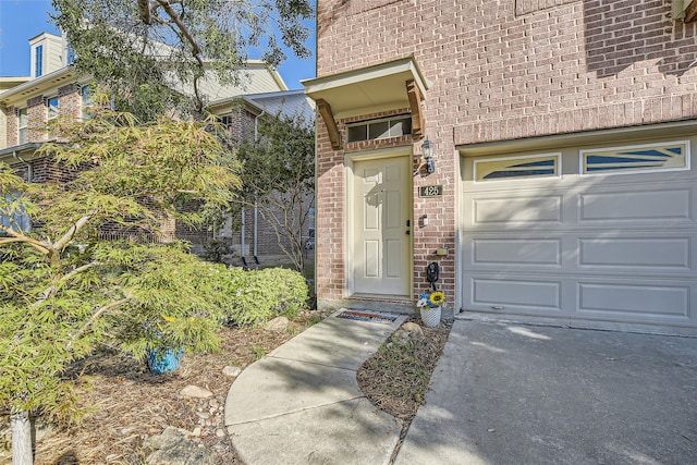 view of exterior entry with a garage