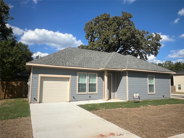 single story home featuring a garage