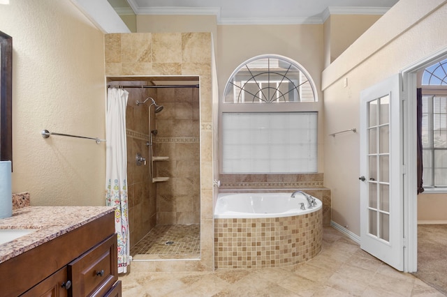 bathroom with independent shower and bath, vanity, crown molding, and a healthy amount of sunlight