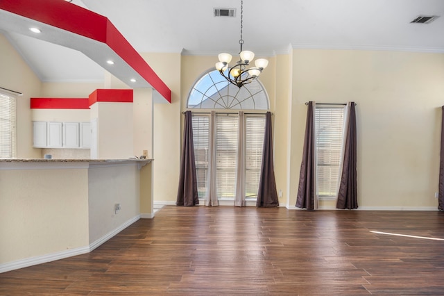 interior space featuring a notable chandelier, crown molding, and dark hardwood / wood-style flooring