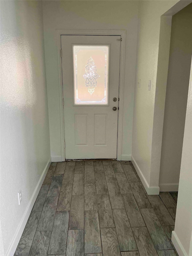 doorway with dark hardwood / wood-style flooring