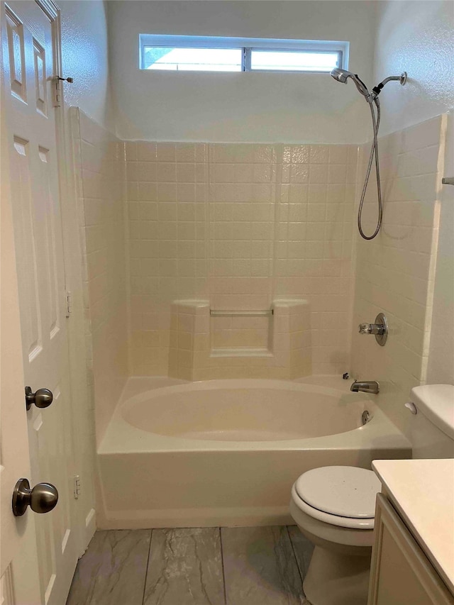 full bathroom with  shower combination, vanity, and toilet