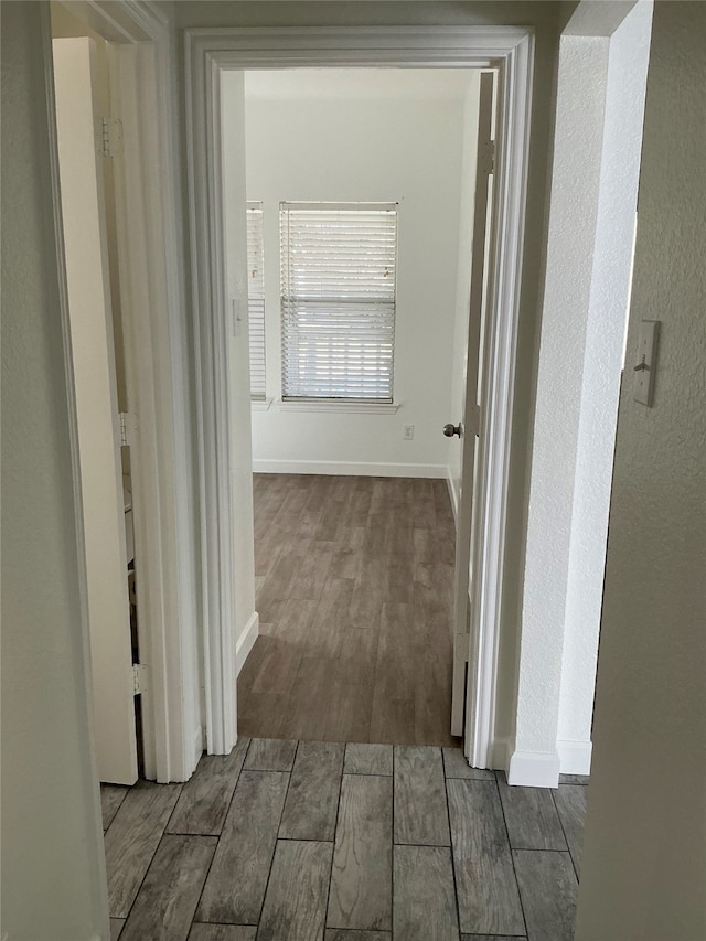 hallway with light wood-type flooring